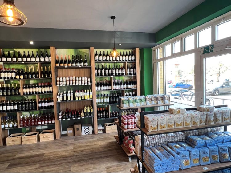 Shelves of wine and pasta inside the Salumeria